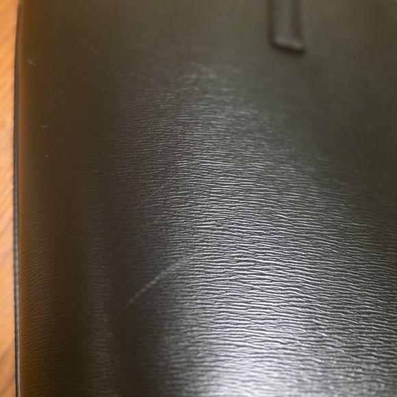 DKNY Bryant Medium Zippered Tote Bag in black leather with gold-tone hardware.  - Picture 15 of 17